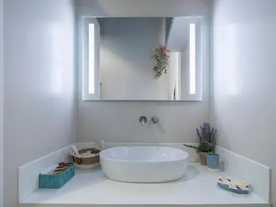 a bathroom with a large white tub and a mirror at Navona Charming Balcony in Rome