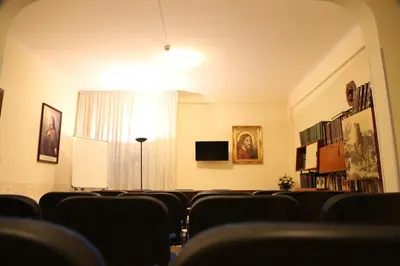a room with chairs and a window with a light at Casa Piccole Ancelle di Cristo Re in Rome