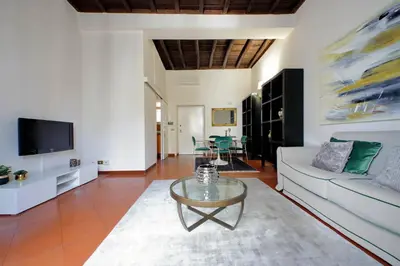 a living room with a couch and a table at Leonina4 Cozy Apartment in Rome