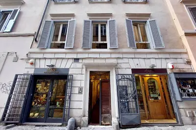 a building with doors and windows on a street at Leonina4 Cozy Apartment in Rome