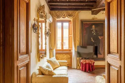 a living room with a couch and a television at iFlat Golden Gem in Trevi in Rome