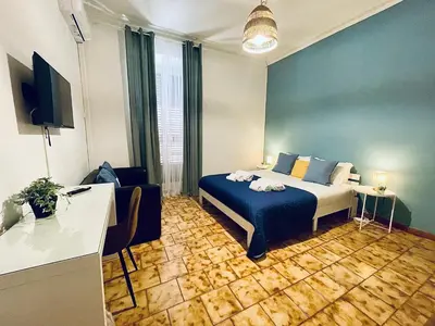 a bedroom with a yellow bed with towels on it at Monteverde Hideaway in Rome