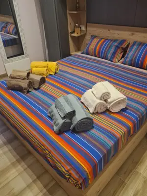a bed with towels and towels on it at Casa Sorelle Marchisio in Rome
