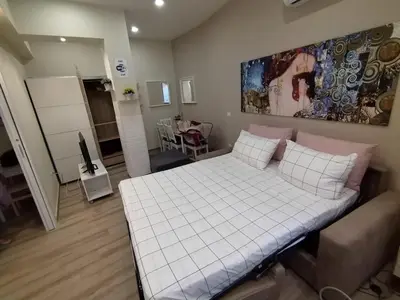 a bedroom with a bed and a living room at Casa Sorelle Marchisio in Rome