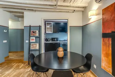 a dining room with a table and chairs at Appartamento centro storico BACCINAHOME in Rome