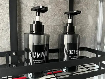 two bottles of shampoo and soap on a shelf at La casa di Eurialo in Rome