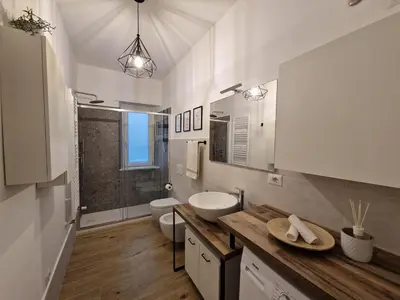 a bathroom with a sink and a toilet at La casa di Eurialo in Rome