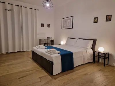 a bedroom with a bed with two towels on it at La casa di Eurialo in Rome