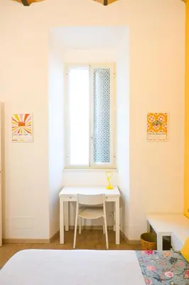 a bedroom with a white table and a window at Casa Pesa 2 rooms 2 baths Rome center in Rome