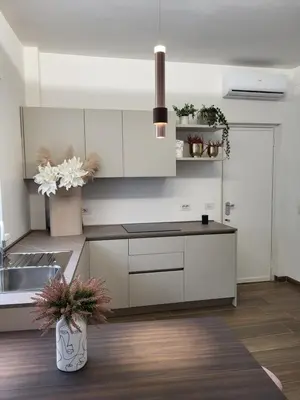 a kitchen with white cabinets and a sink at Buongiorno al Vaticano in Rome