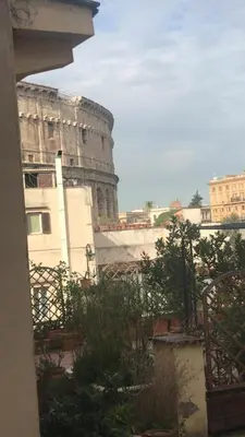 a view of the coliseum from a balcony of a building at Colosseum Rome Guest House Luil in Rome