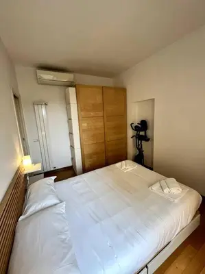 a large white bed in a room with a camera at St. Peter Home Private Terrace in Rome