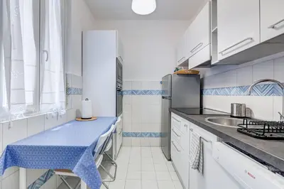 a kitchen with a blue counter top and a sink at Luminous Apartment few steps from Piazza Navona in Rome