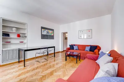 a living room with a couch and a table at Luminous Apartment few steps from Piazza Navona in Rome
