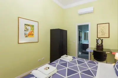 a bedroom with a bed with towels on it at Luxury Three Bedrooms flat in Roma Center in Rome