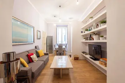 a living room with a couch and a table at Luxury Three Bedrooms flat in Roma Center in Rome