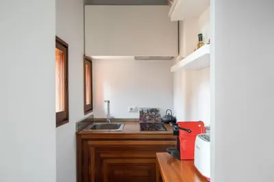 a small kitchen with a sink and a counter at iFlat Loft&Pool in Trastevere in Rome