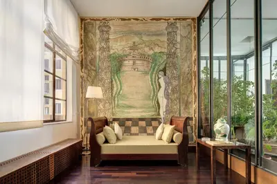 a room with a couch and a painting on the wall at Palazzo Berardi: Renaissance Downtown Luxury Villa in Rome