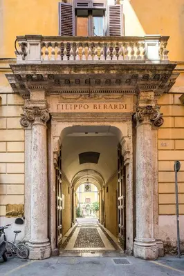 an entrance to a building with an archway at Palazzo Berardi: Renaissance Downtown Luxury Villa in Rome