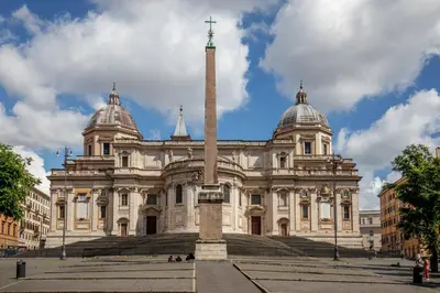 a large building with a pole in front of it at Daplace - Hotel Gran Torino Suites in Rome