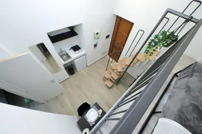 a view of a living room and stairs in a house at Katia Charme in Rome