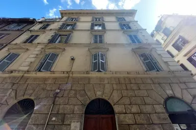 a tall building with a door in front of it at Katia Charme in Rome
