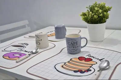 a table with a plate of pancakes and a coffee mug at Torretta Flat in Rome