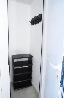 a walk in closet with a black dresser at Torretta Flat in Rome