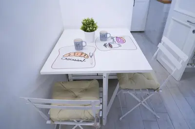 a white table with two chairs and a table with two cups at Torretta Flat in Rome