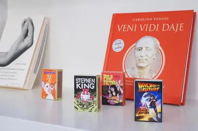 a group of books sitting on a table at Torretta Flat in Rome