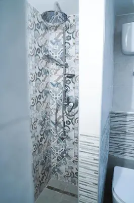 a bathroom with a shower with a shower curtain at Torretta Flat in Rome