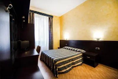 a hotel room with a bed and a television at Funny Holiday in Rome