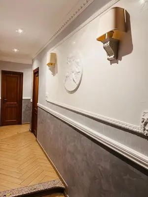 a hallway with a counter and lights on the wall at Funny Holiday in Rome