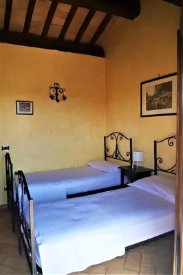 a bedroom with a bed and a wooden dresser at La Valle dei Casali Green Boutique in Rome