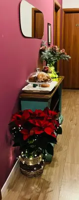 a counter with a bunch of flowers in a room at Termini Suite Inn Rome in Rome