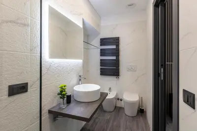 a bathroom with a white tub and a sink at Residenza Sacconi by Hili in Rome