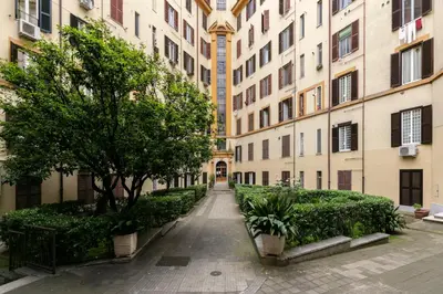 an empty street in a city with buildings at Residenza Sacconi by Hili in Rome