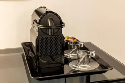 a tray with two glasses and a juicer on a table at Residenza Sacconi by Hili in Rome