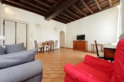 a living room with a couch and a table at suity I cozy coronari apartment in Rome