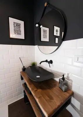 a bathroom with a black sink and a mirror at Loft stupendo nel cuore di Trastevere AcasadiCri in Rome