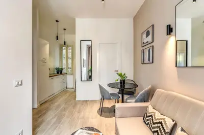 a living room with a couch and a table at Vatican Charming Home in Rome