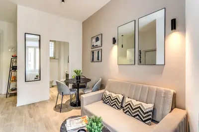 a living room with a couch and a table at Vatican Charming Home in Rome
