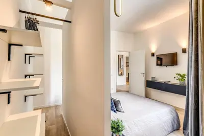 a small bedroom with a bed and a bathroom at Vatican Charming Home in Rome