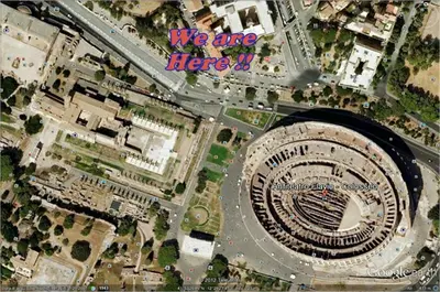 an overhead view of a street with a round road at Colosseum Street in Rome