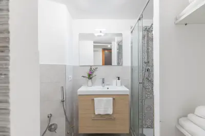 a bathroom with a sink and a shower at GuestHost - Comfy Studio x2 - Trastevere District! in Rome