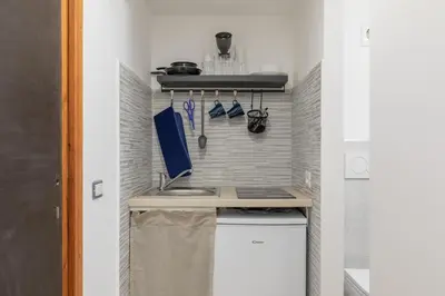 a small kitchen with a sink and a counter at GuestHost - Comfy Studio x2 - Trastevere District! in Rome