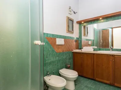 a bathroom with a toilet and a sink at Apartment Navona by Interhome in Rome