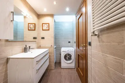 a bathroom with a washing machine and a washer and dryer at Big Apartment Rome Air Conditioning WIFI Netflix 90 MQ in Rome