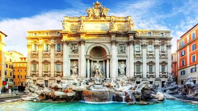 an old building with columns on a city street at Big Apartment Rome Air Conditioning WIFI Netflix 90 MQ in Rome