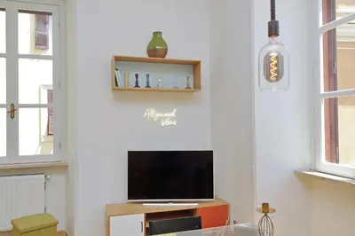a living room with a flat screen tv on a wall at Luxury Vatican White House in Rome